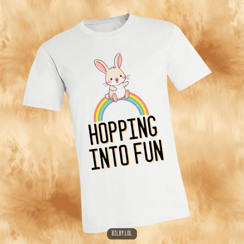 Funny bilby hopping joyfully over a small, sparkling rainbow arc printed on a t-shirt, perfect for a humorous and magical gift.