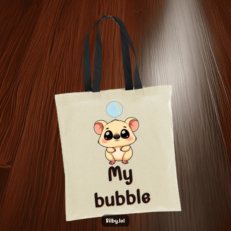 Funny tote bag with a chubby marsupial with large eyes tipping its head curiously towards a floating bubble.